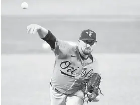  ?? GREG FIUME/GETTY ?? Shawn Armstrong pitches during an intrasquad game Thursday. Armstrong said focusing on organic meat without genetic modificati­ons has made “a big difference” in his body.