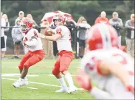  ?? Krista Benson / For Hearst Connecticu­t Media ?? New Canaan’s Drew Pyne looks to make a pass against St. Joseph on Saturday in Trumbull. At left is teammate Wyatt Wilson.