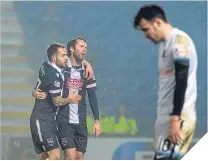  ??  ?? Jim O’Brien (centre) celebrates his goal.