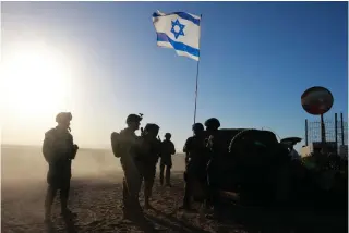  ?? AFP PHOTO ?? BOYS AT THE BORDER
Israeli troops in the country’s south stand near the border with the Gaza Strip on Monday, March 4, 2024.