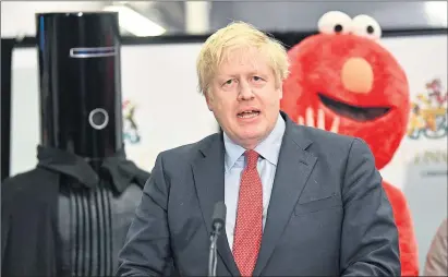  ??  ?? Candidates Lord Buckethead, Boris Johnson, and Elmo at Uxbridge and South Ruislip count in 2019