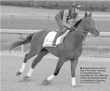  ?? AP Photo/Charlie Riedel ?? ■ Kentucky Derby entrant Bolt d'Oro trains Thursday at Churchill Downs in Louisville, Ky. The 144th running of the Kentucky Derby is scheduled for Saturday.