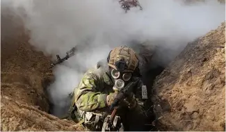  ?? ?? Ukrainian National guard soldiers simulate assault operations during tactical training at a shooting range in Kharkiv region, Ukraine, on Thursday, Feb. 29, 2024.