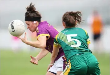  ??  ?? Wexford attacker Caitríona Murray taking on Emma Troy of Meath.