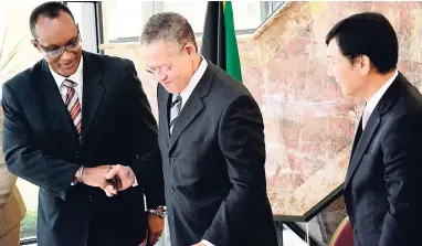  ?? FILE ?? In this September 2011 photo, then Prime Minister Bruce Golding (centre) greets Ancile Brewster (left), then country representa­tive, Inter-American Developmen­t Bank, and Ki-Mo Lim, chargé d’affaires, Embassy of the Republic of Korea, at the launch of...