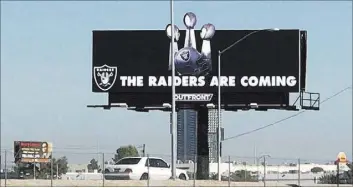  ?? Heidi Fang Las Vegas Review-Journal ?? The Raiders updated their billboard at the Las Vegas stadium site in early September, showing the team’s three Super Bowl trophies.