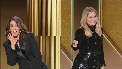  ?? NBC VIA AP ?? In this video grab issued Sunday by NBC, hosts Tina Fey, left, from New York, and Amy Poehler, from Beverly Hills, speak at the Golden Globe Awards.