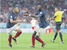  ?? ?? Kylian Mbappe, left, celebrates with Marcus Thuram.