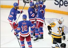  ?? FRANK FRANKLIN II – THE ASSOCIATED PRESS ?? The New York Rangers celebrate a goal by Artemi Panarin during the third period of Thursday’s Game 2 win over the Pittsburgh Penguins.