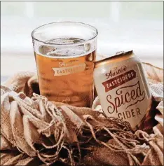  ?? CONTRIBUTE­D ?? Cozy up to a can of Austin Eastciders’ newest flavor, the Spiced Cider, which is refreshing enough for summer but even better in the fall.