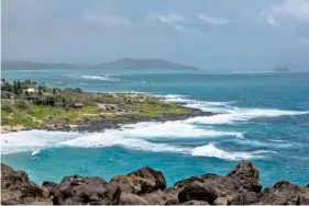  ?? AP PHOTO/EUGENE TANNER ?? High surf breaks on Oahu’s Windward coast as seen from the Makapuu Lookout on Sunday in Honolulu. The high winds and big surf are being generated by Hurricane Douglas.