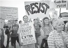  ?? ODED BALILTY, AP ?? Israeli and American activists demonstrat­e outside the U.S Embassy in Tel Aviv on Monday.