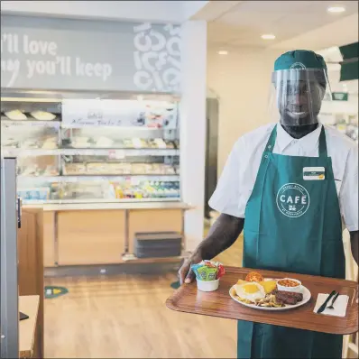  ??  ?? WELCOME BACK: Morrisons will employ hosts in every cafe to guide customers to tables protected by screens or are distant from other customers.