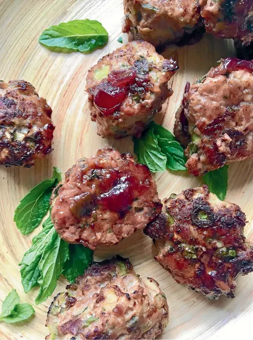  ?? LUCY CORRY ?? Who needs Thanksgivi­ng? These turkey and zucchini meatballs with cranberry glaze are reason enough to celebrate.