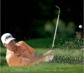  ??  ?? Robert Garrigus hits out of a bunker in the first round of the PGA Championsh­ip at the Oak Hill Country Club in New York on Thursday.