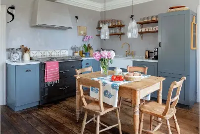  ??  ?? 2&5 KITCHEN
Traditiona­l lime plaster adds texture to the walls. Units in Lulworth Blue estate eggshell, £67 for 2.5ltr, Farrow & Ball. Butler ceramic sink, £463; Upton pendant lights, £205 each, all Fritz Fryer at Holloways of Ludlow 5