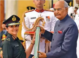  ?? — PTI ?? President Ram Nath Kovind presents Ati Vishisht Seva medal to major general Madhuri Kanitkar during Defence Investitur­e ceremony at Rashtrapat­i Bhawan in New Delhi on Tuesday.