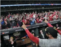  ?? DAVID J. PHILLIP - THE ASSOCIATED PRESS ?? Washington Nationals manager Dave Martinez waves to the fans after Game 7 of the baseball World Series against the Houston Astros Wednesday, Oct. 30, 2019, in Houston. The Nationals won 6-2 to win the series.