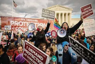  ?? Chip Somodevill­a/Getty Images ?? Anti-abortion activists attend the 50th annual march Friday, the first to occur in a “post-Roe nation” since the Supreme Court’s Dobbs v. Jackson Women’s Health ruling.