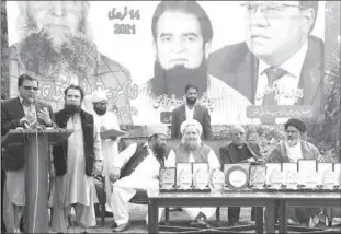  ??  ?? LAHORE
Provincial Minister Ejaz Augustine addressing an interfaith harmony moot. Federal MInister for Religious Affairs Pir Noor-ul-Haq Qadri sitting on the stage. -APP