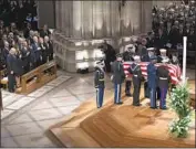  ?? Carolyn Kaster Associated Press ?? THE FLAG-DRAPED casket of former President George H.W. Bush is carried by an honor guard.