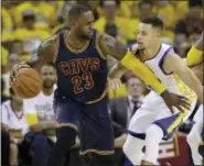  ?? THE ASSOCIATED PRESS FILE PHOTO ?? LeBron James and Steph Curry will face off for the third straight season in the NBA Finals.