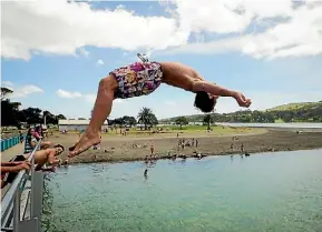  ?? BRUCE MERCER/STUFF ?? Wharf-jumping – or dive-bombing – is a popular Kiwi summer past-time, but left 100s injured in the past year.