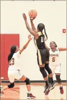  ?? contribute­d by shelly culver ?? Keyarah Berry puts up a jumper against a double team from Vidalia’s defense during a Elite Eight road win on Feb. 25.