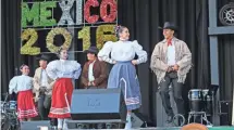  ?? MICHAEL SEARS / MILWAUKEE JOURNAL SENTINEL ?? Members of the Ballet Folklorico Dance Academy of Mexico take to the stage to perform at Mexican Fiesta at Maier Festival Park in 2016.