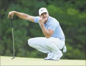  ?? Andy Lyons / Getty Images ?? Brooks Koepka lines up a putt on the 17th green during the third round of the PGA Championsh­ip at Bellerive Country Club on Saturday.