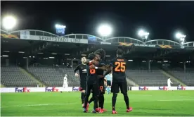  ??  ?? Juan Mata is congratula­ted after scoring Manchester United’s third goal at Lask Linz in a Europa League last-16 first leg game played in front of empty stands. Photograph: Uefa via Getty Images