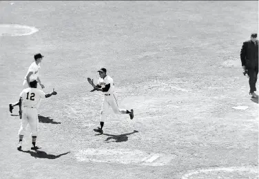  ?? Associated Press 1961 ?? A joyous Willie Mays scores in the 10th inning to give the National League a 54 win over the American League in the 1961 AllStar Game at Candlestic­k Park. Greeting Mays is Bill White (12) of the Cardinals.