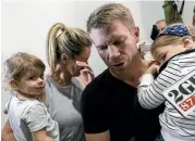  ?? BROOK MITCHELL/GETTY IMAGES ?? David Warner arrives back at Sydney Airport with his wife Candice and their children to face the music.