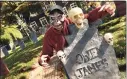  ?? Arnold Gold / Hearst Connecticu­t Media ?? Eric Andrewsen stands over one of the many tombstones he created n front of his house on Whitney Avenue in Hamden.