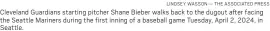  ?? LINDSEY WASSON — THE ASSOCIATED PRESS ?? Cleveland Guardians starting pitcher Shane Bieber walks back to the dugout after facing the Seattle Mariners during the first inning of a baseball game Tuesday, April 2, 2024, in Seattle.