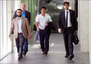  ?? CP PHOTO SEAN KILPATRICK ?? Unifor president Jerry Dias, centre, arrives to take part in NAFTA negotiatio­ns in Ottawa on Tuesday.