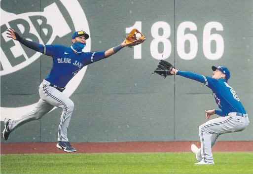  ?? BOSTON GLOBE FILE PHOTO VIA GETTY IMAGES ?? The defensive work of left-fielder Lourdes Gurriel Jr., beating Cavan Biggio to a fly ball at Fenway in September, improved by leaps and bounds in 2020.