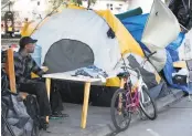  ?? Paul Chinn / The Chronicle ?? Shawn Moses sits in his space at a homeless camp on Northgate Avenue in Oakland. He says he has lived there for three years.