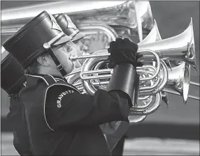  ?? Photo by Randy Moll ?? The brass section of the Gravette High School Marching Band played during the National Anthem on Friday in Lion Stadium.