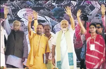  ?? RAJESH KUMAR/HT ?? Uttar Pradesh governor Ram Naik (left), chief minister Yogi Adityanath and Prime Minister Narendra Modi with other BJP leaders at a public meeting in Mirzapur on Sunday.