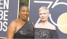  ?? JORDAN STRAUSS/INVISION ?? At last year’s 75th annual ceremony, social activist and founder of the #MeToo movement Tarana Burke (left) and actress Michelle Williams were among those wearing black in protest.