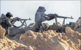  ?? AFP ?? Fighters with the Us-backed Syrian Democratic Forces take part in an operation to expel Islamic State militants in the Baghouz area of Deir Ezzor, Syria, on Wednesday.