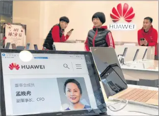  ?? THE CANADIAN PRESS/AP-NG HAN GUAN ?? A profile of Huawei’s chief financial officer Meng Wanzhou is displayed on a Huawei computer at a Huawei store in Beijing, China, Thursday. Canadian authoritie­s said Wednesday that they have arrested Meng for possible extraditio­n to the United States.