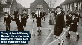  ?? ?? Young at heart: Walking through the school doors transports Richard back to his own school days