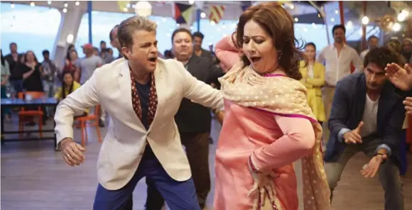  ??  ?? Anil Kapoor, left, cuts up the dance floor in Bollywood film Dil Dhadakne Do. The three-hour comedy is about a dysfunctio­nal Punjabi family on a Mediterran­ean cruise.