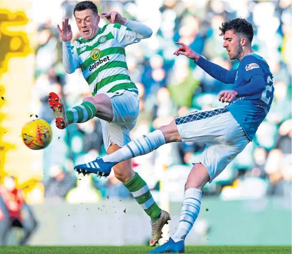  ?? Picture: SNS Group. ?? Saints’ Sean Goss clears from the in-rushing Callum McGregor in yesterday’s cup tie.