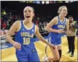  ?? DAVID BECKER — THE ASSOCIATED PRESS ?? UCLA's Gina Conti (10) and Emily Bessoir react after beating Arizona in the Pac-12quarterf­inals Thursday.