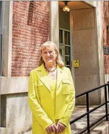  ??  ?? Susan Scrimshaw, retiring president of The Sage Colleges, stands Saturday morning in front of the newly re-christened Scrimshaw Health Sciences Hall on the Russell Sage College campus in downtown Troy.