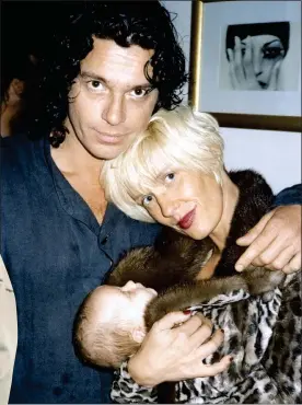  ??  ?? SHUT OUT: Hutchence and Yates with Tiger Lily in 1996. Left: Tiger today