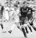  ?? REINHOLD MATAY/USA TODAY PHOTOS ?? New York midfielder Vincent Bezecourt (left) and Orlando City’s Will Johnson battle for the ball during the second half.